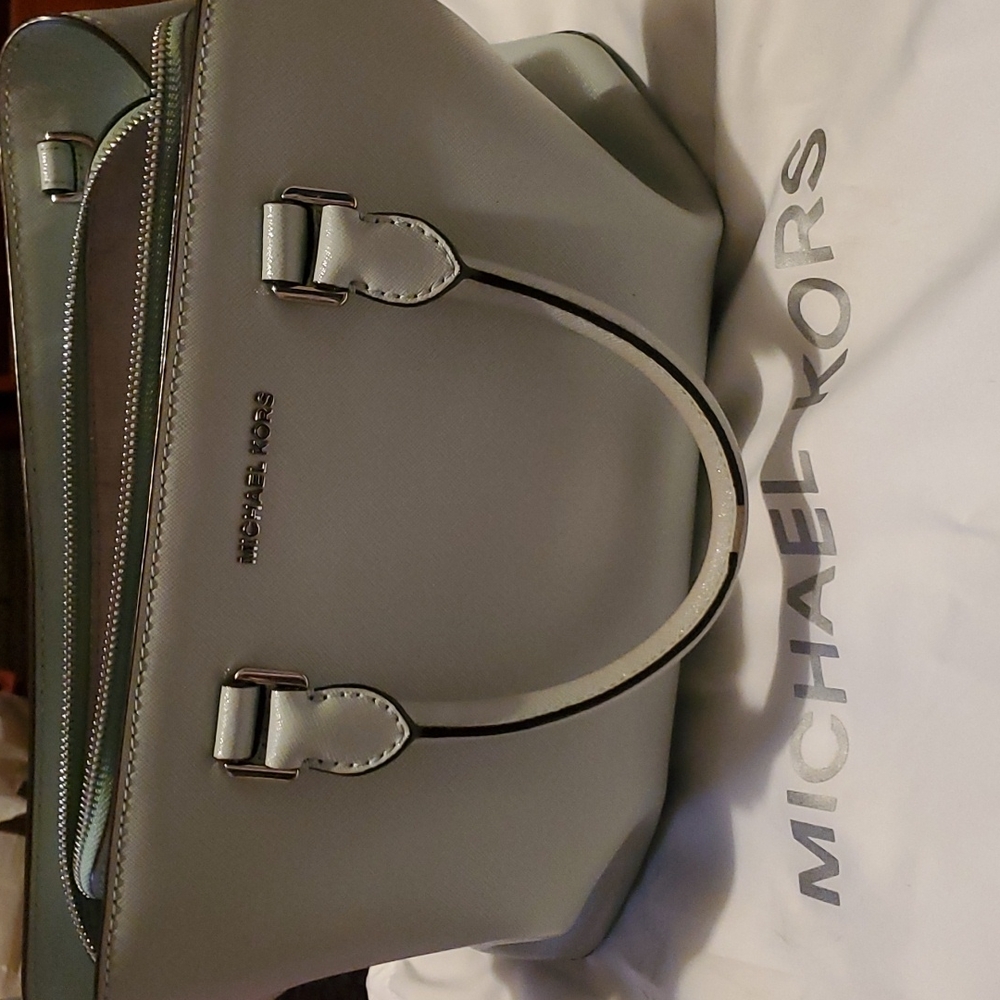 Preloved ice blue Michael Kors purse. With duster bag